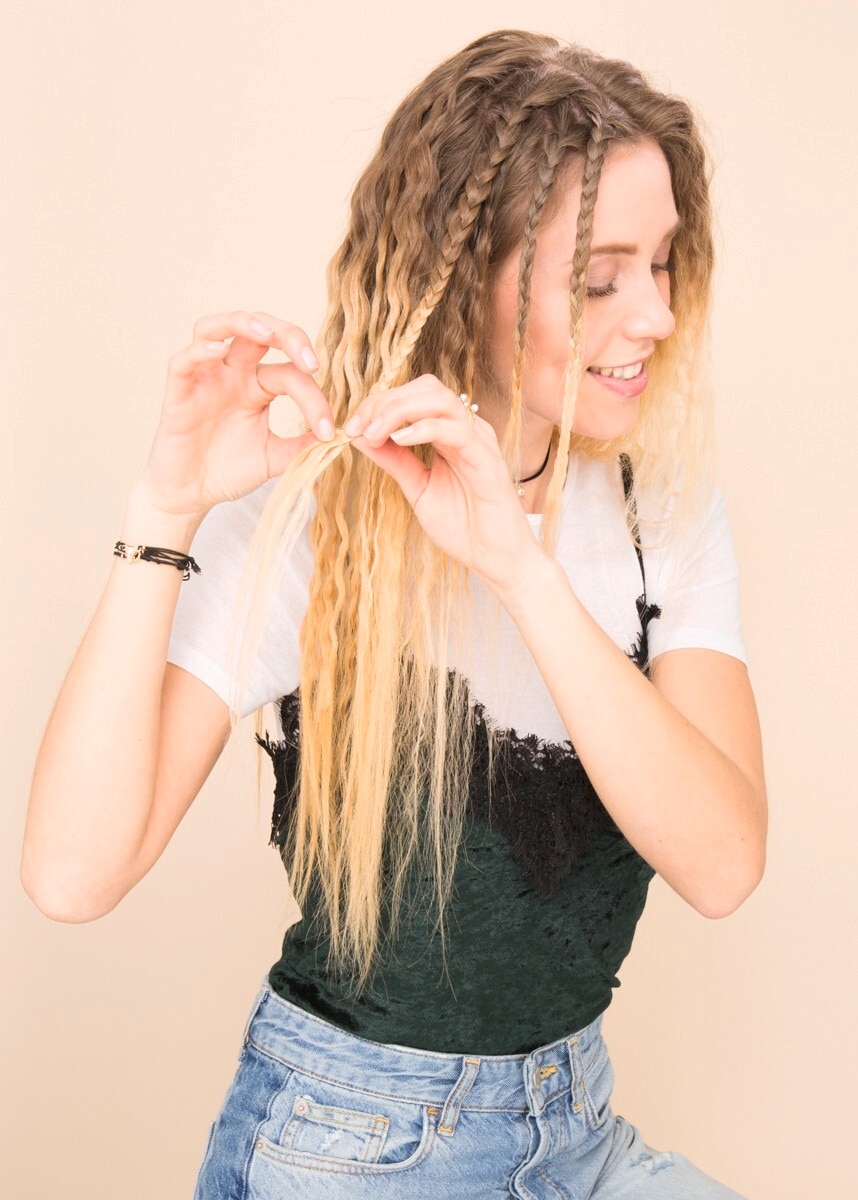 Asian hairstyles: Asian woman with bob and bangs with crimped finish wearing sunglasses.