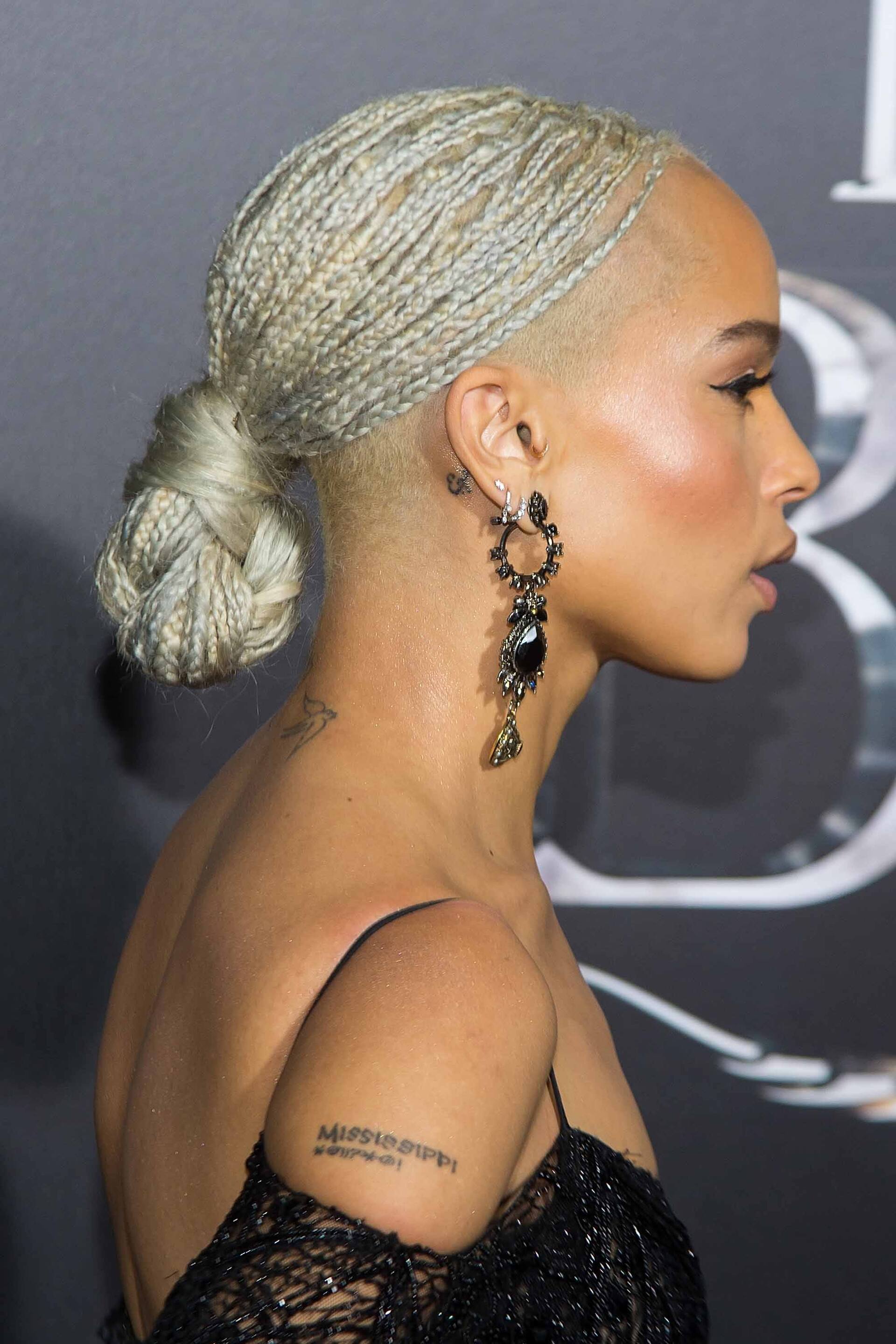 Ideas for crazy hair day: Blonde runway model with her hair in tiny random braids, wearing a black sweatshirt and silver skirt