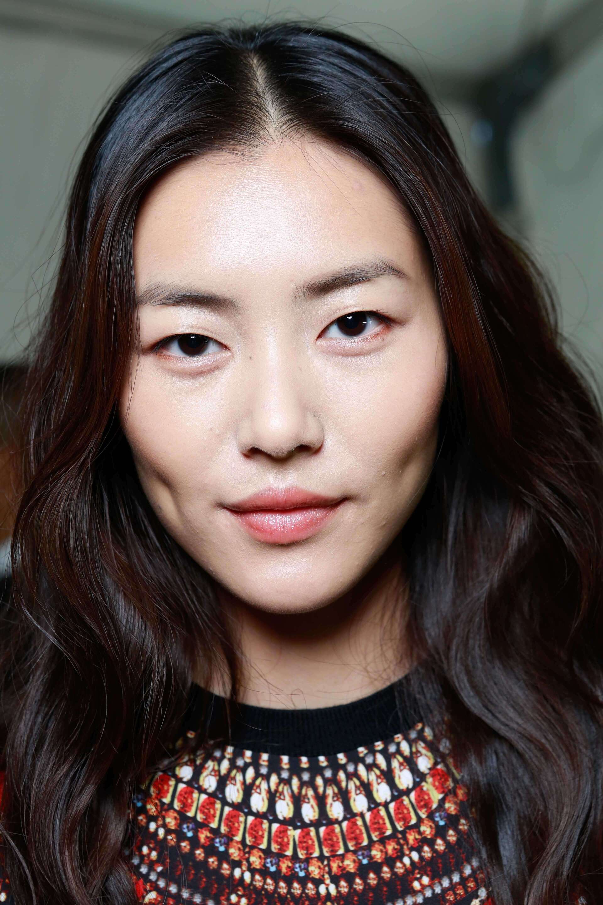 Woman with dark brown Korean style bangs