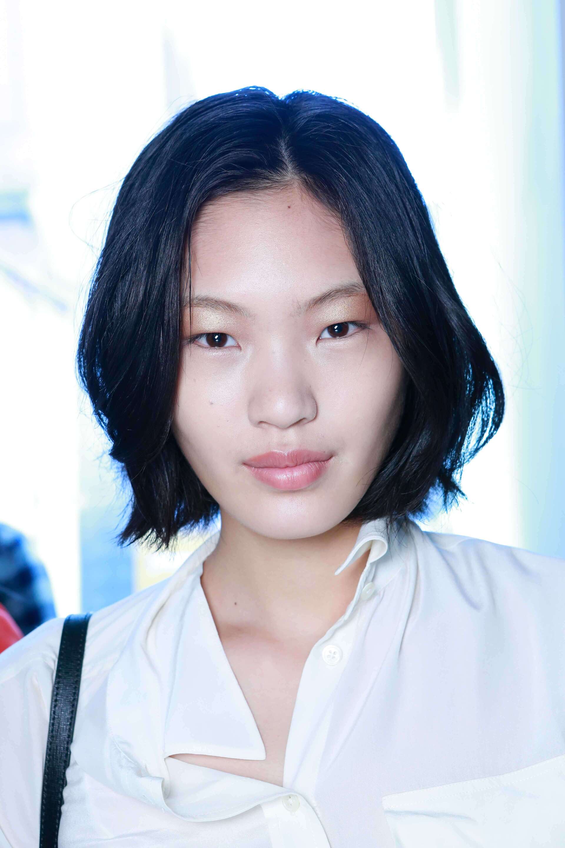 Woman with textured short Asian long bob haircut