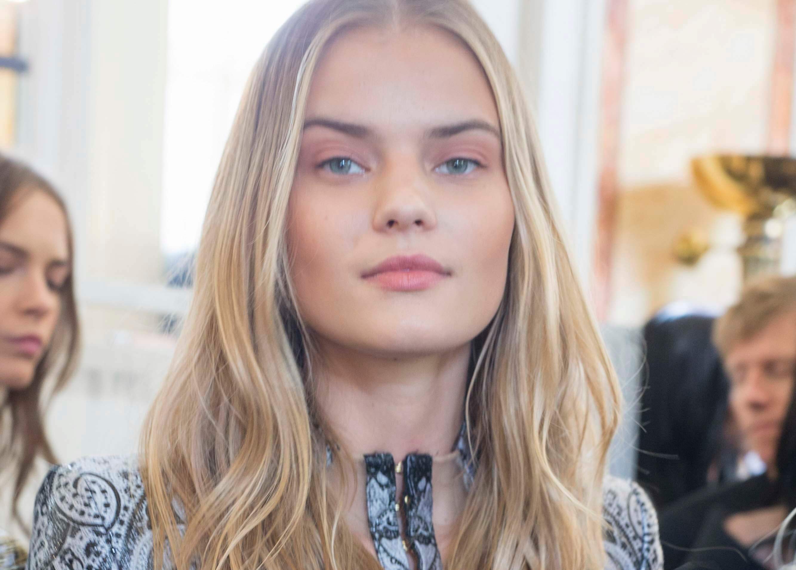 image of a woman with touseled wavy hair - dirty blonde