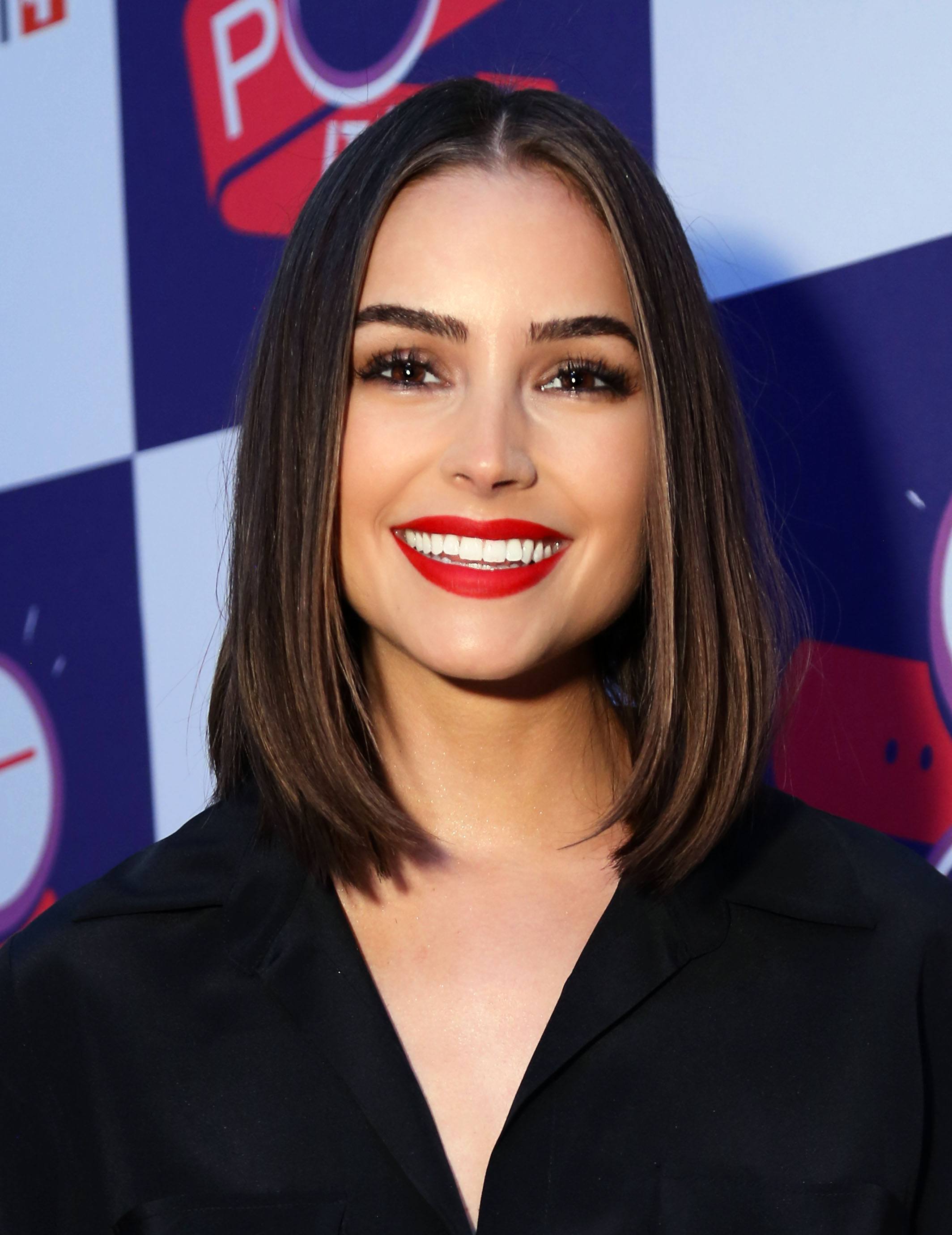 Olivia Culpo menggunakan warna highlight light golden brown pada rambutnya.(Foto: REX by Shutterstock)