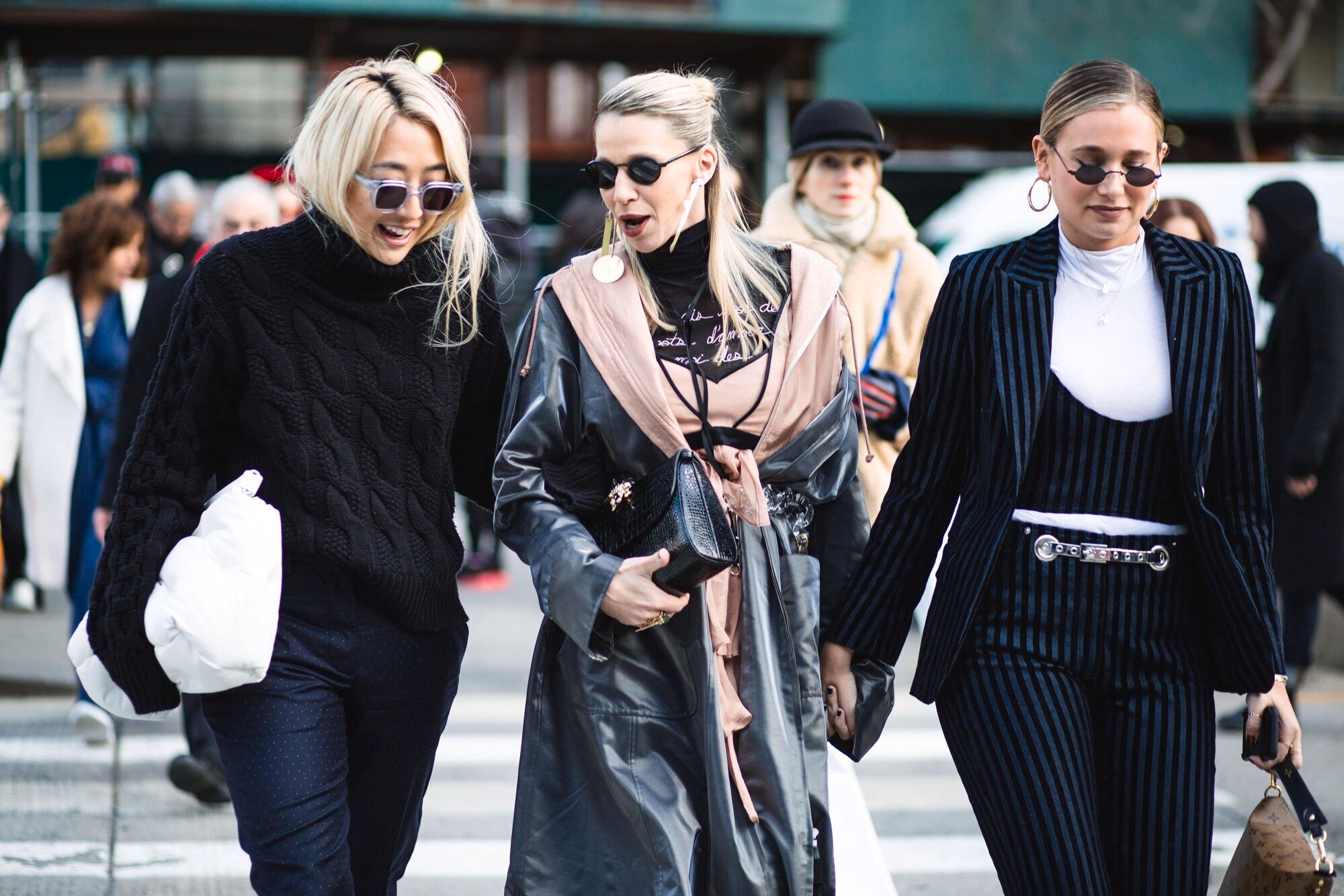 Grown out bangs: Street style woman with fine medium length ash blonde hair with blunt bangs.