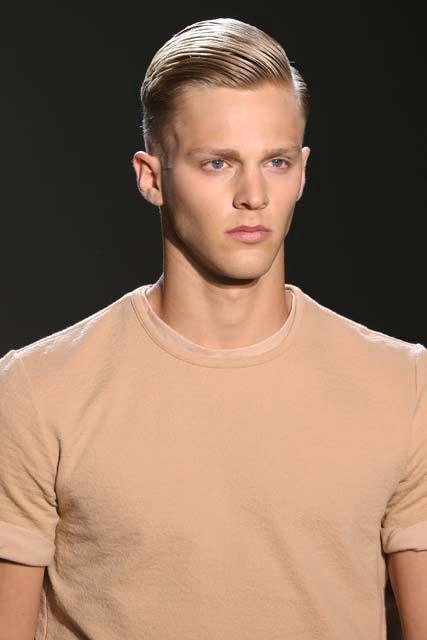 Brown haired man with a braided hair design