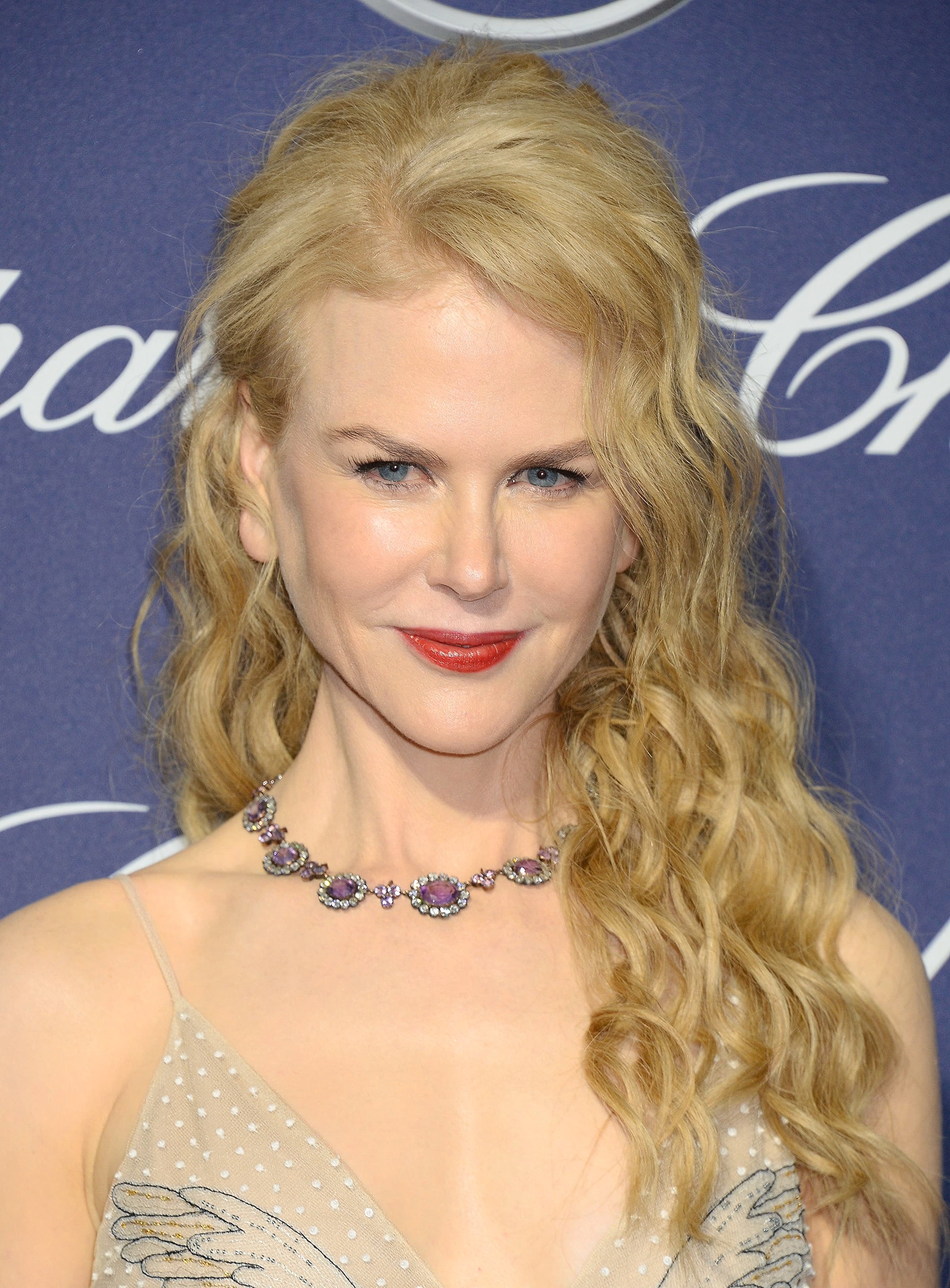 Nicole Kidman with strawberry blonde long hair with curls