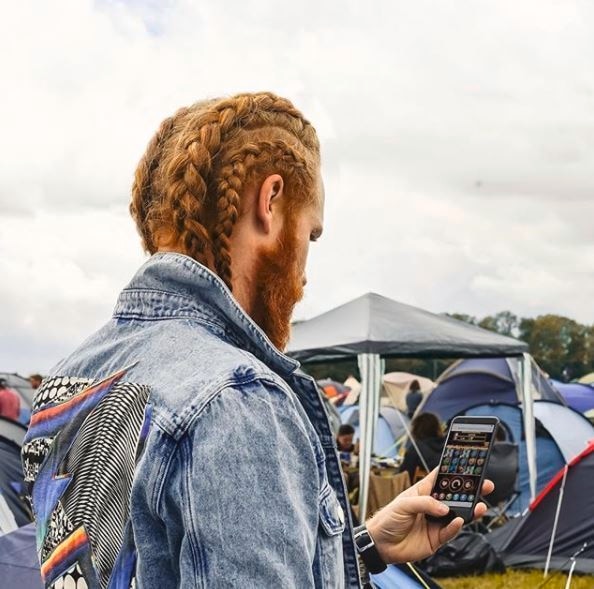 Viking hairstyles: Shot of man with full beard with long top hairstyle with low fade