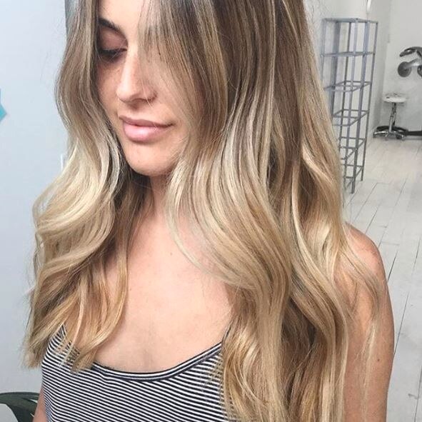 Woman with wavy blonde long bob