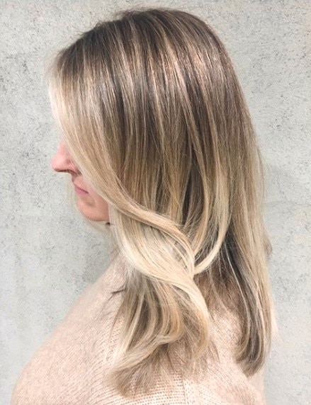 image of a woman with long dirty blonde wavy hair
