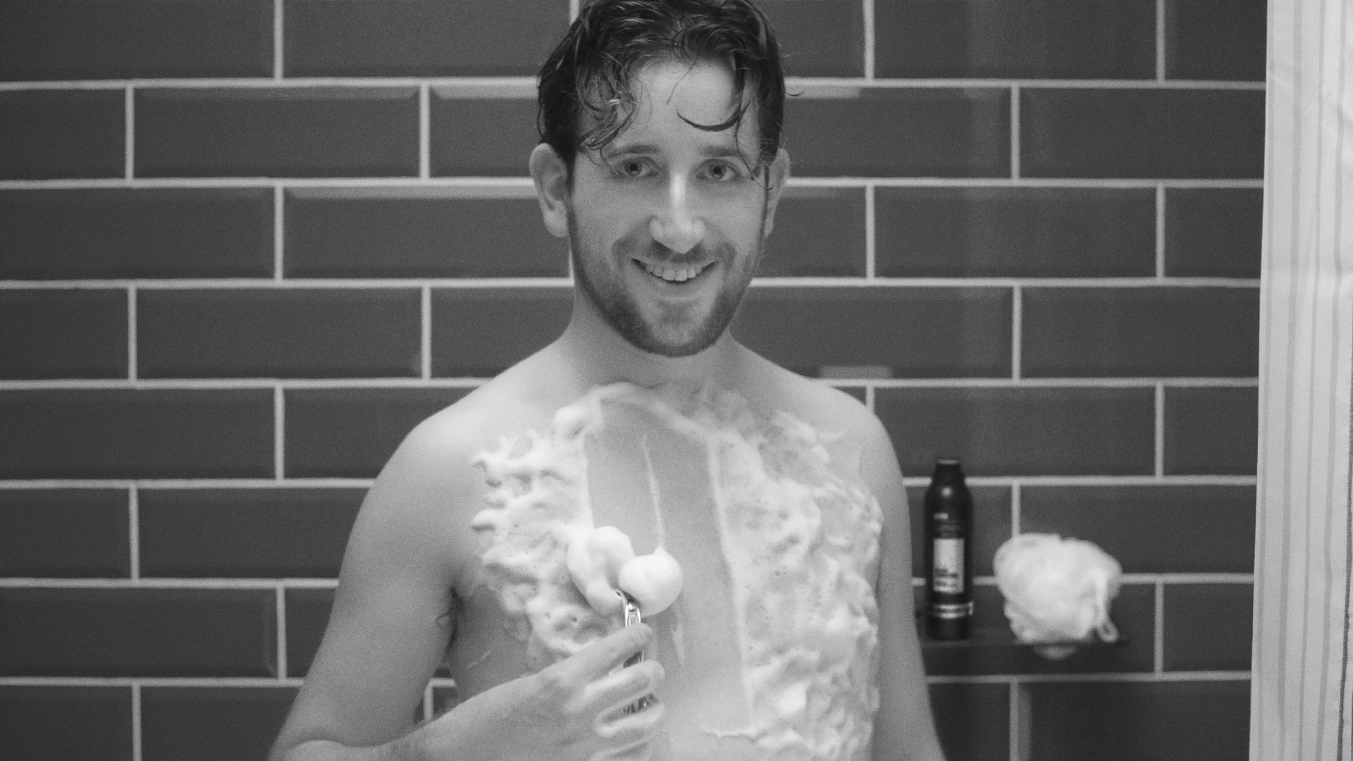 A man teaching how to shaving chest