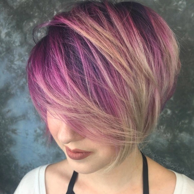 Asian hairstyles: Asian woman with short layered light brown pixie hair.