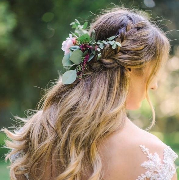 side view of a woman with blonde balayage hair with loose beach wavy hair and a crystal pearl headband