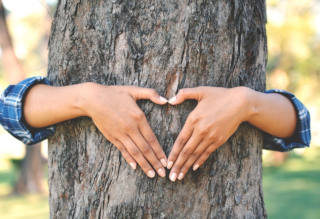 Reduce Carbon Footprint: Woman and Tree