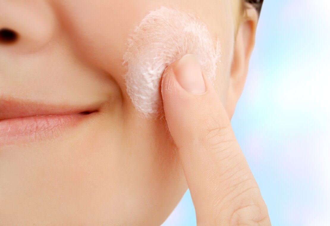 What Are Parabens? Image of Woman Applying Product to Face