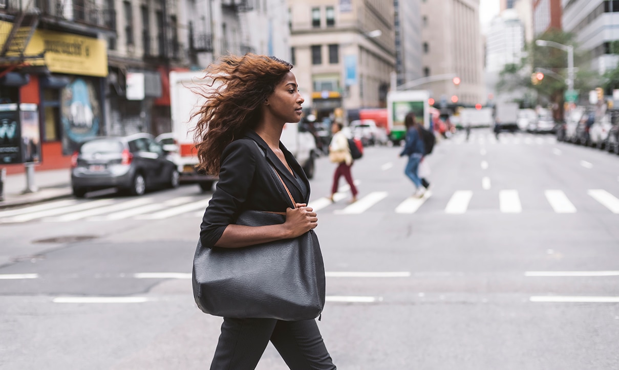 Young woman walking on a path. 