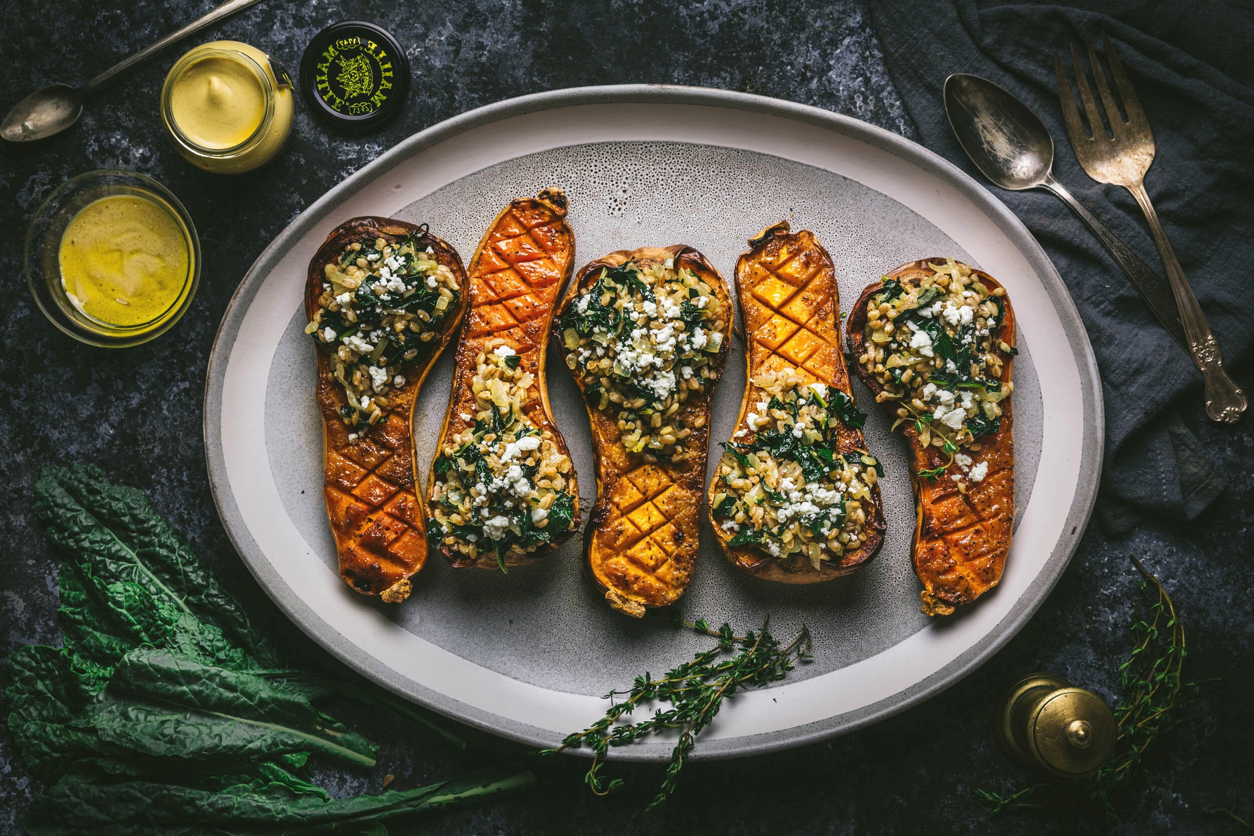 Maille Mustard and Maple-Glazed Butternut Squash Stuffed With Farro and Winter Greens