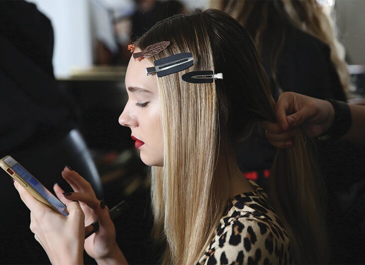 A blonde model getting her hair done.