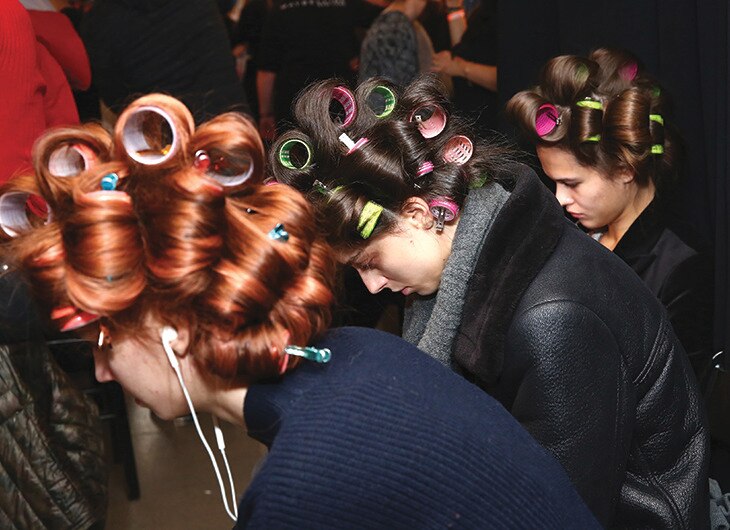 Two models getting her hair done.