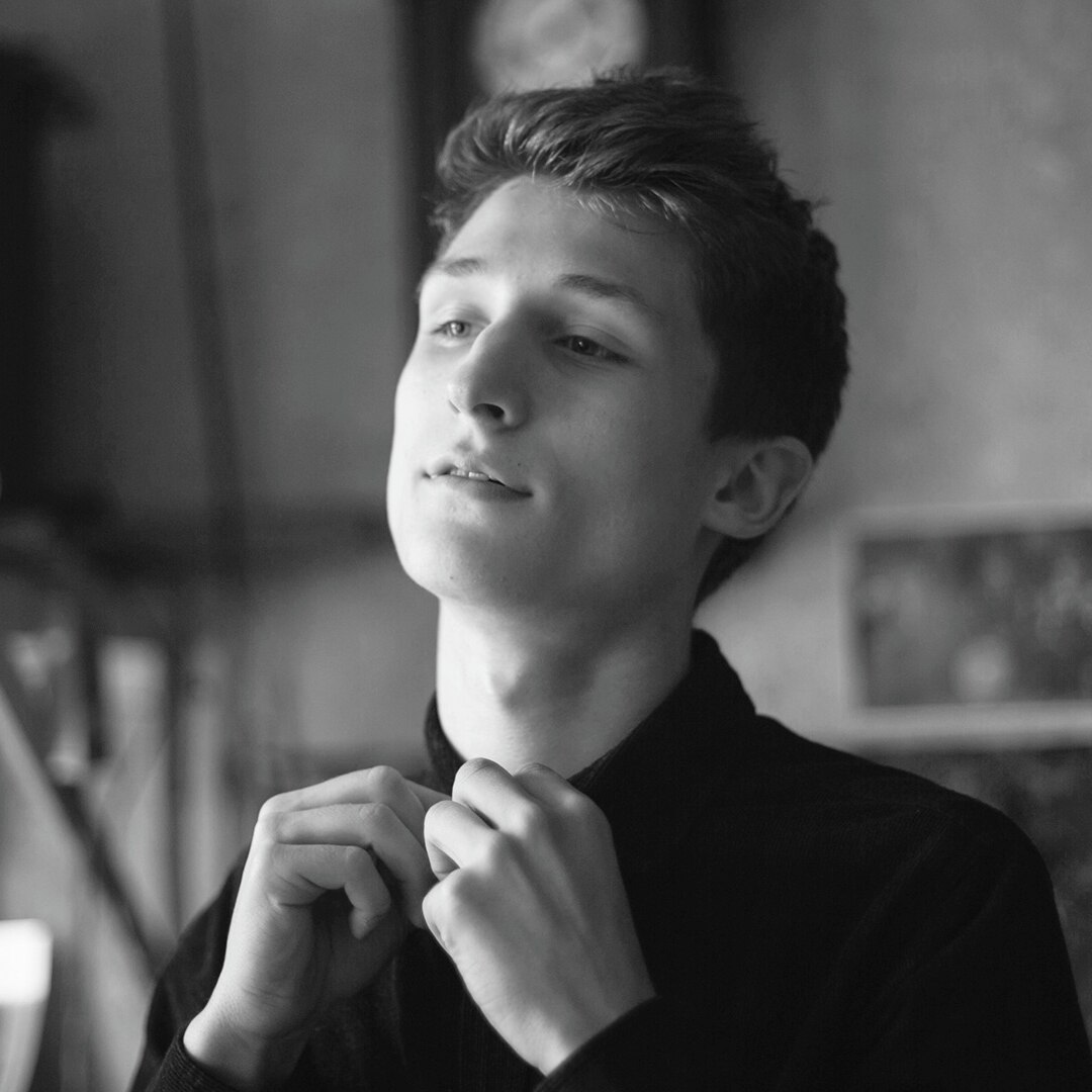 A guy with a freckles and a close crop