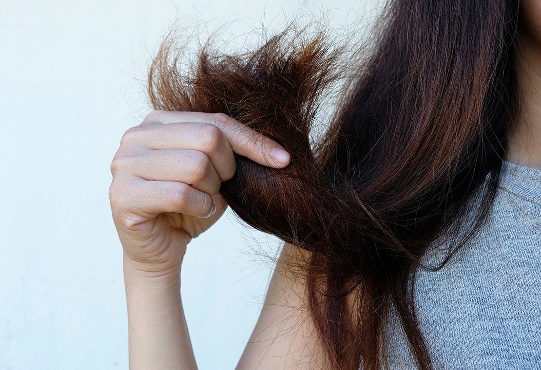 Hair Porosity: Woman Holding Ends of Hair
