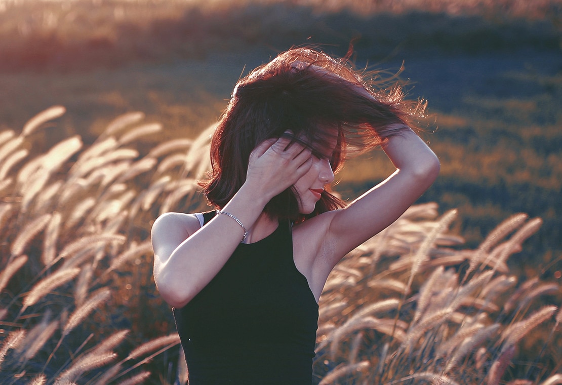 What Is Hair Milk: Red Haired Woman In A Field