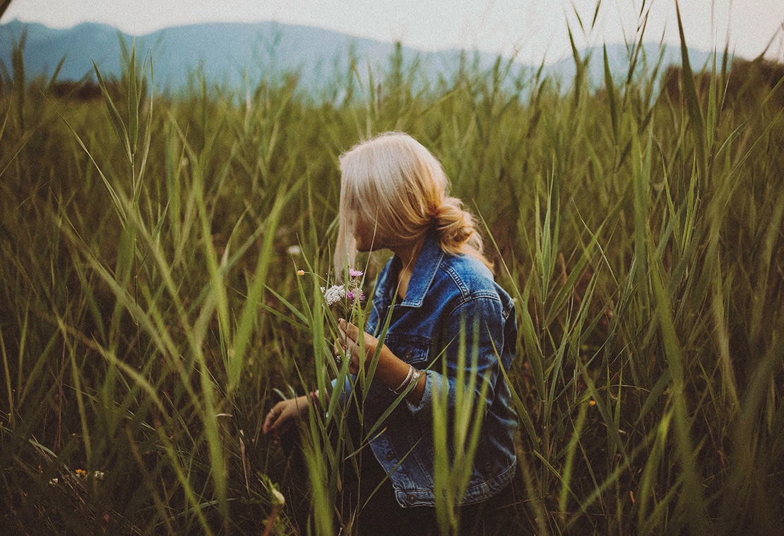 Shampooing 101: Image of Woman with Blonde Hair Walking Through Field