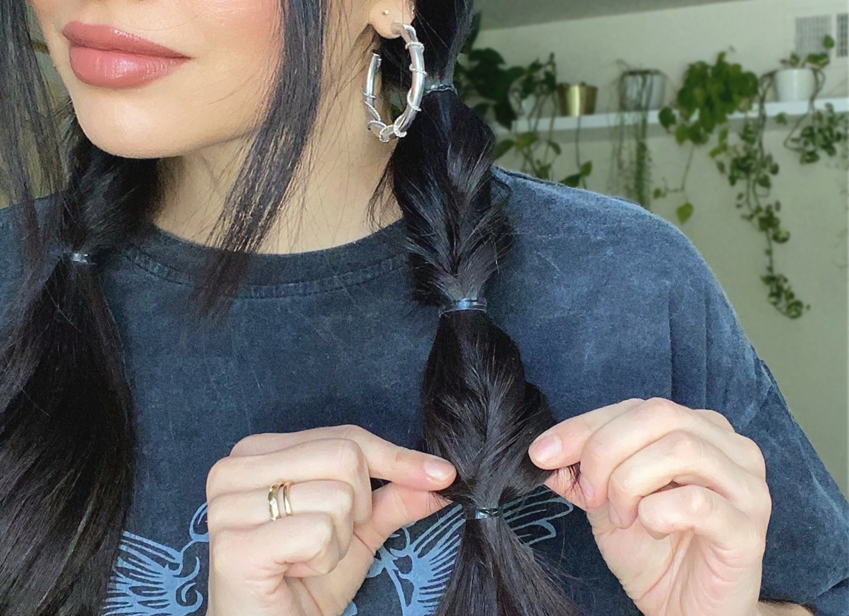 Use your fingers to loosen and pull apart the hair, then repeat through the remaining length of the ponytails.