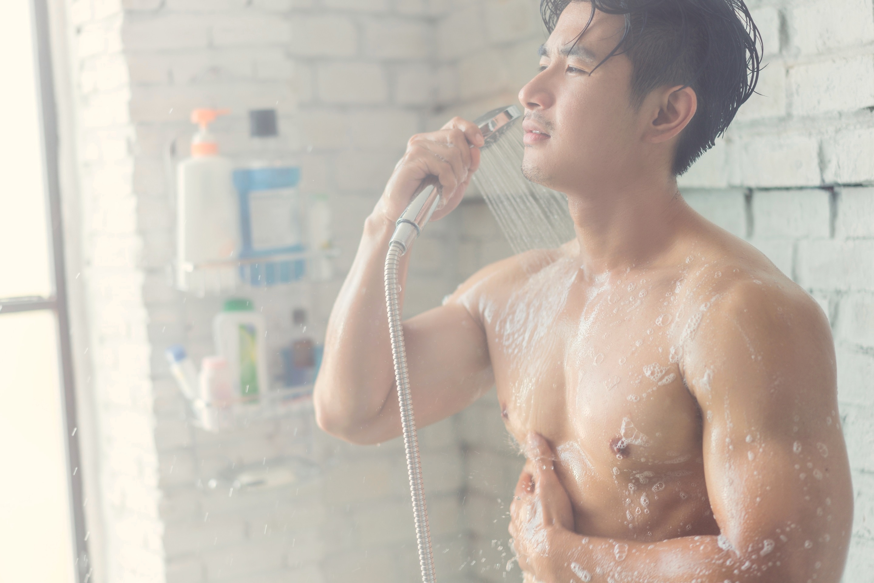 Man washing his hands with soap and water