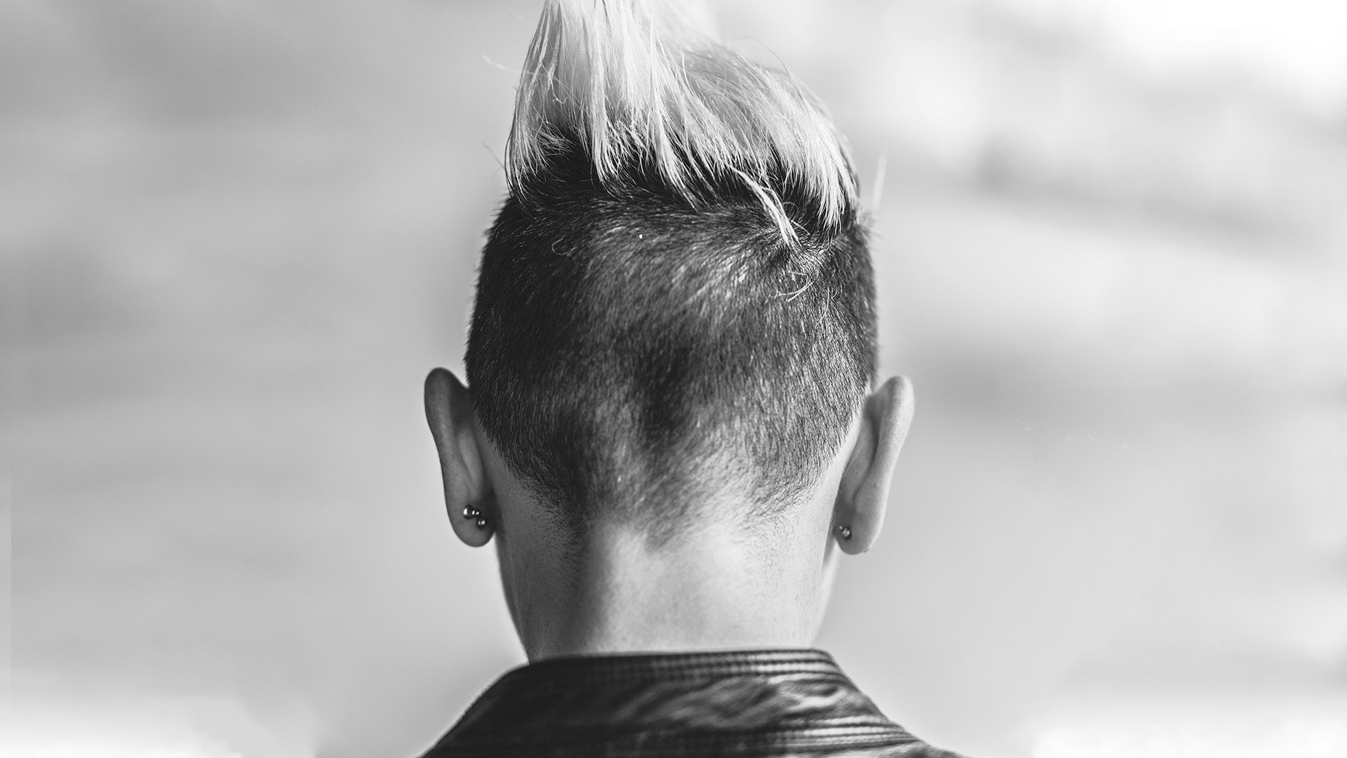 A girl with bleached blonde mohawk