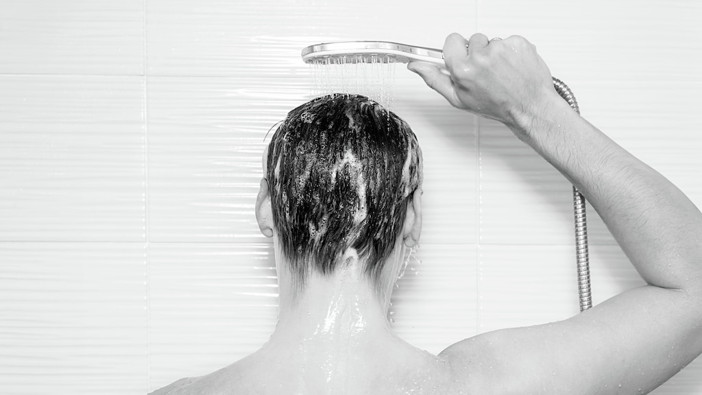 back of guy's head in shower