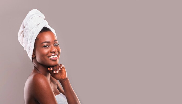 Beautiful African woman with towel wrapped on her head
