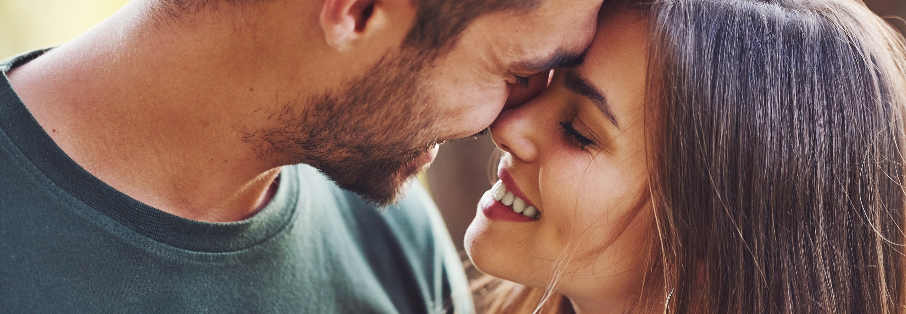 Couple smiling and holding each other