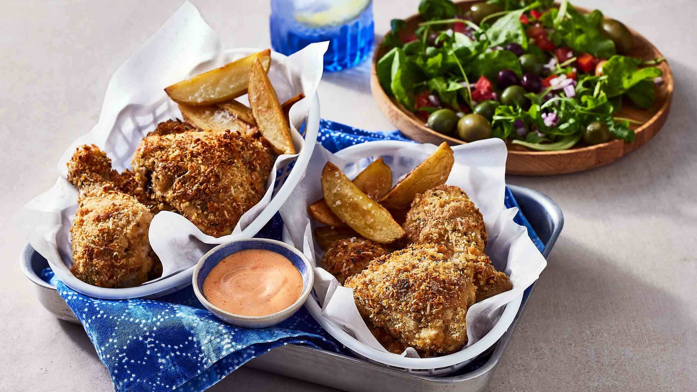 oven fried chicken with potato wedges and dipping sauce
