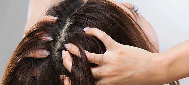 Women checking scalp