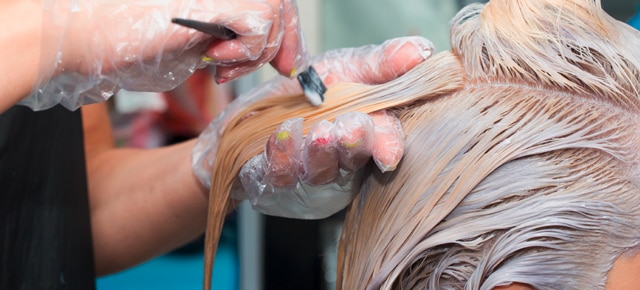 Hair being colour treated Text