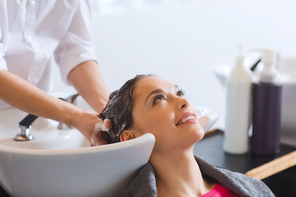 Woman having her hair washed at a salon.