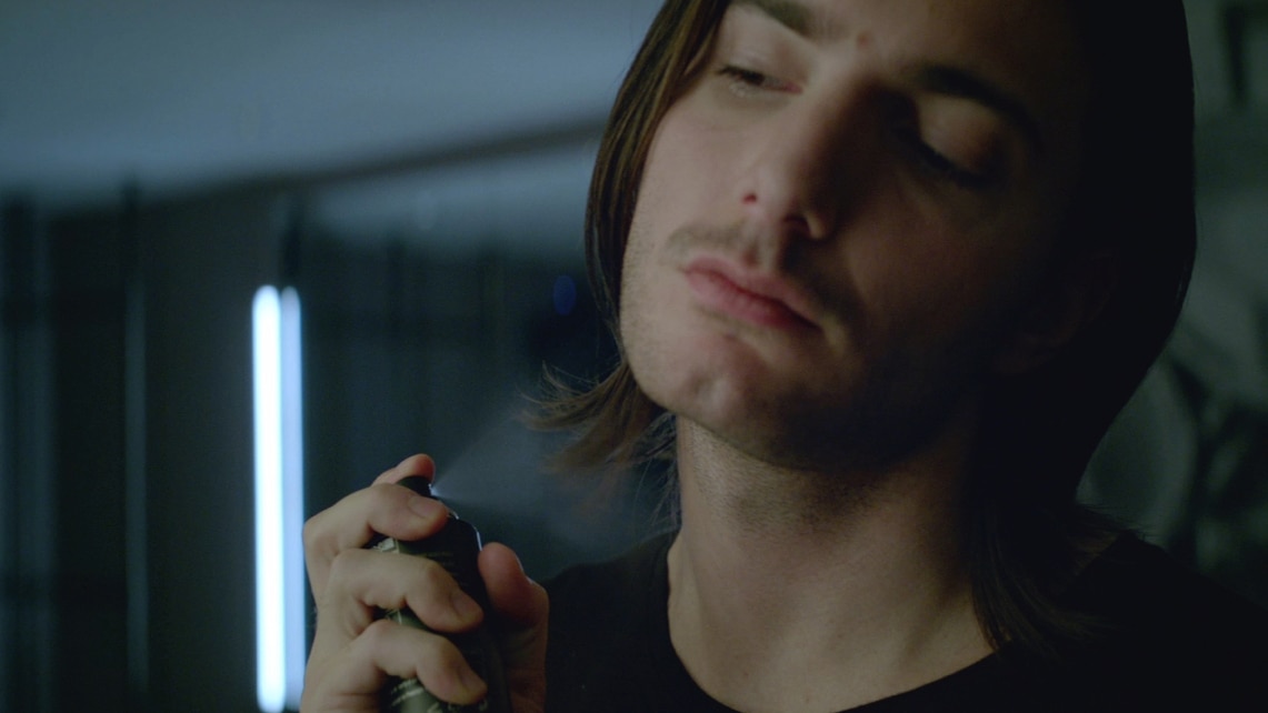 Alesso spraying some Axe daily fragrance.