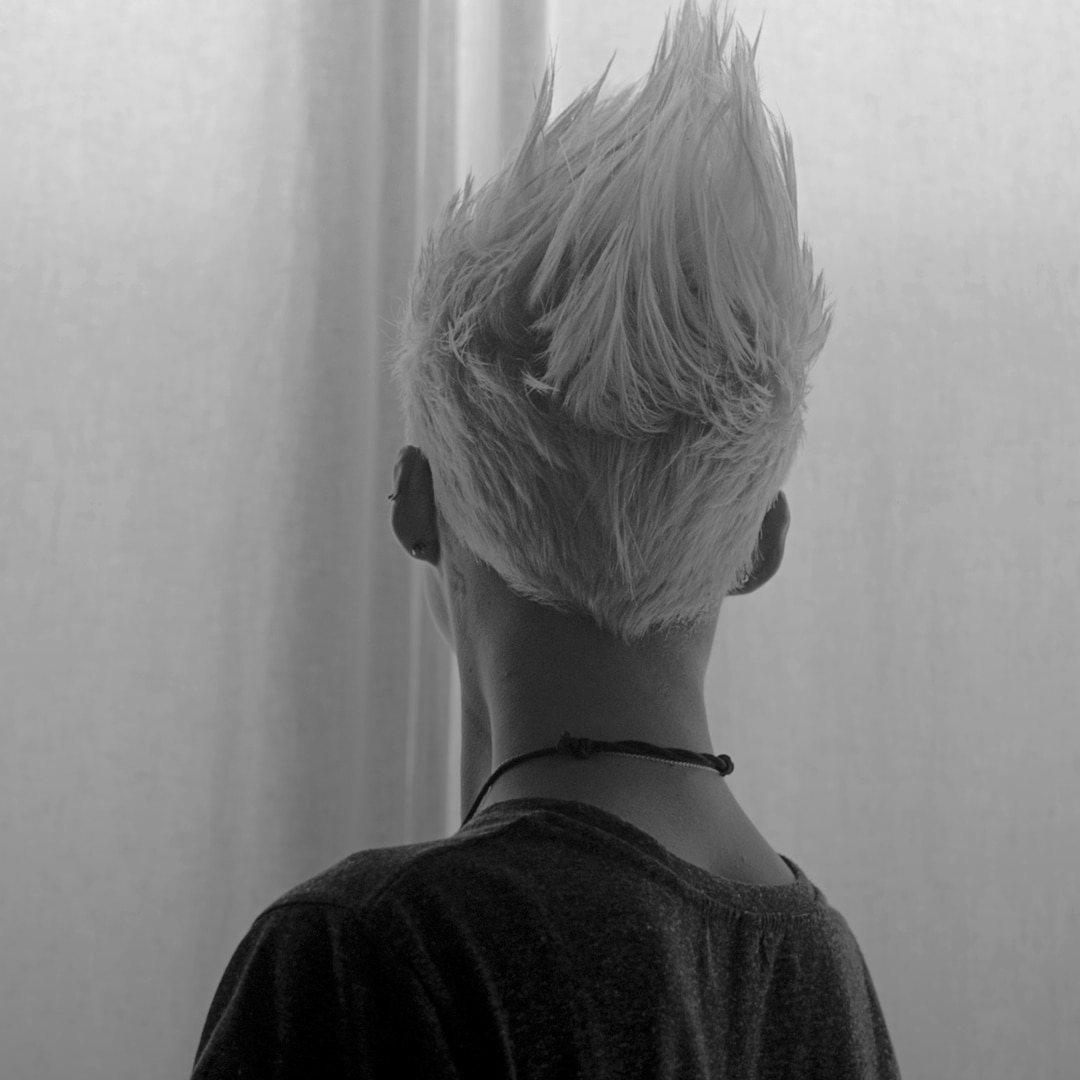 A blonde girl's mohawk, seen from the back.
