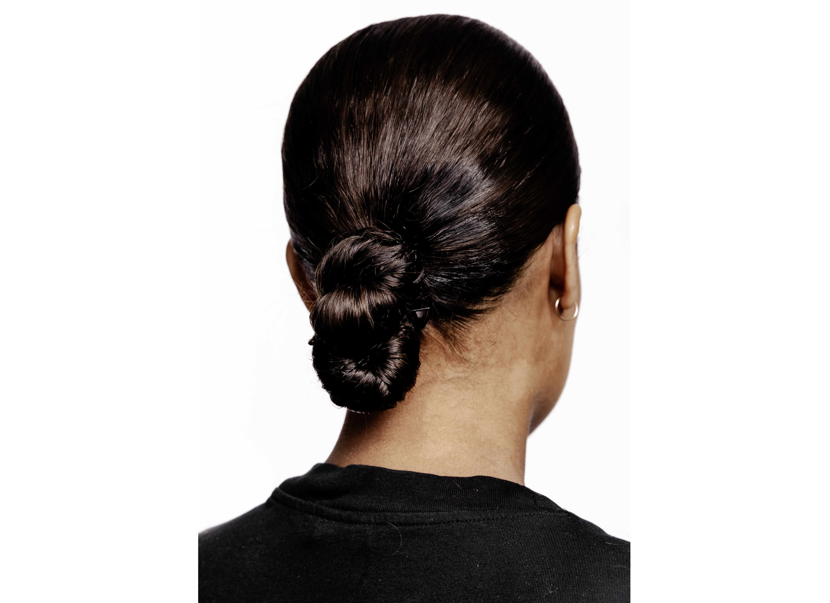 Woman with two flat twist low buns