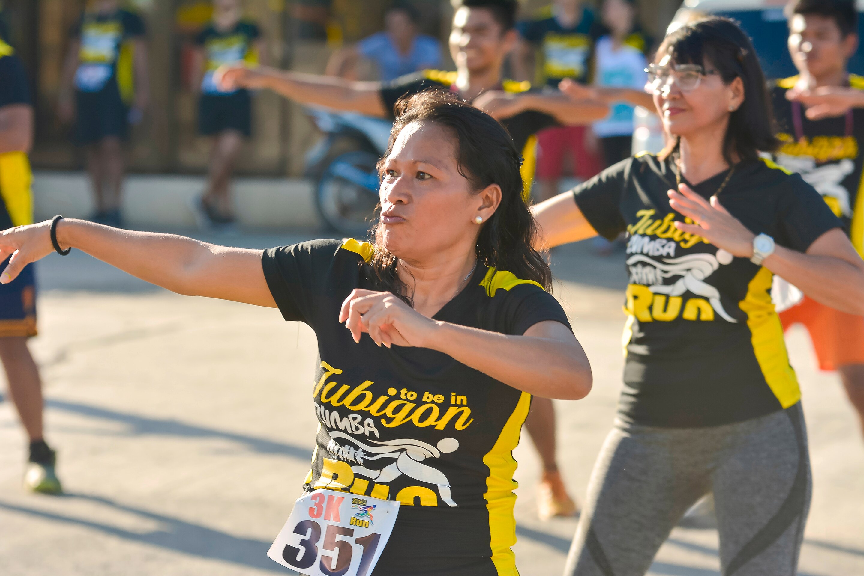 Filipino women doing Zumba outdoors