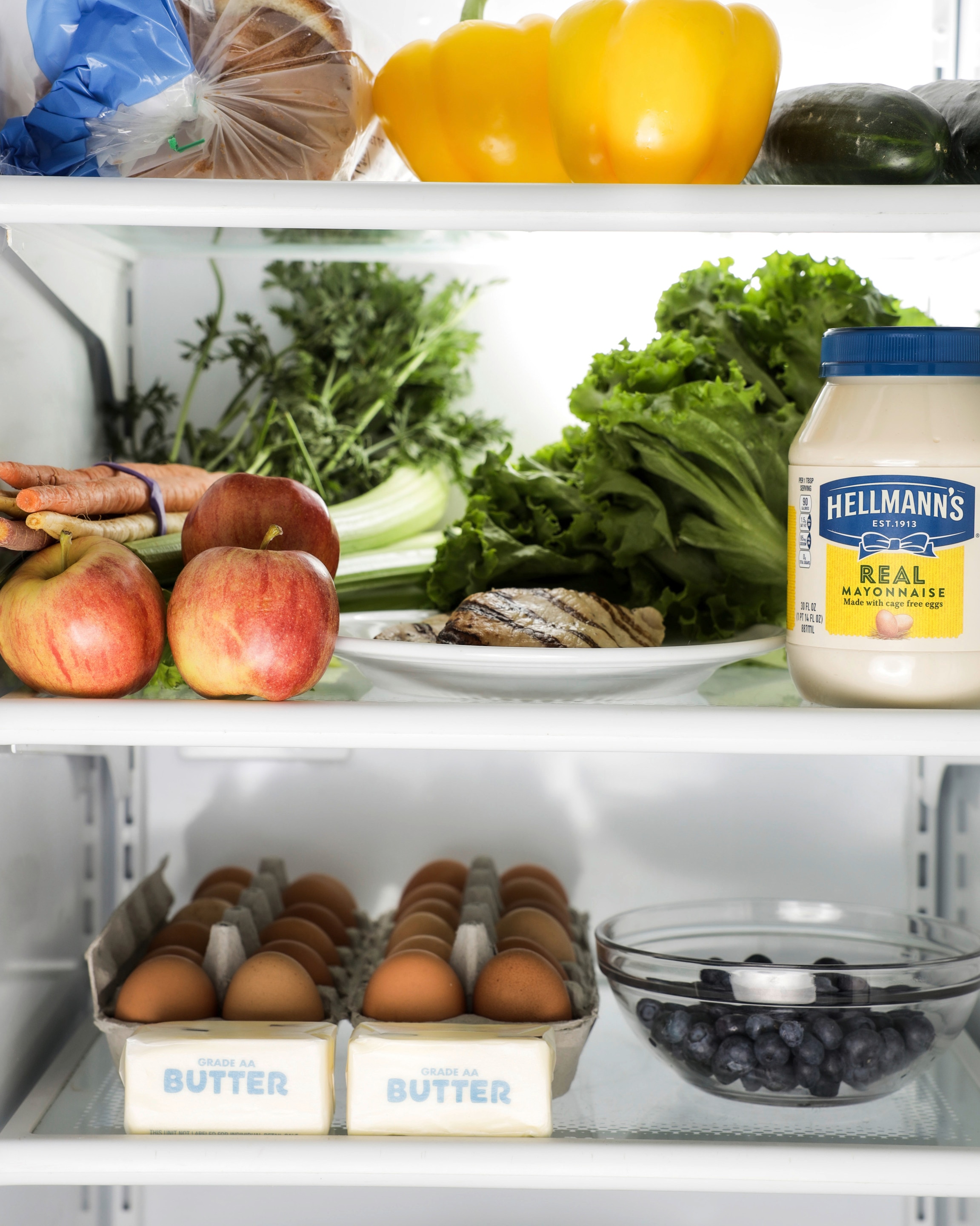 Hellmann's mayonnaise and produce in fridge