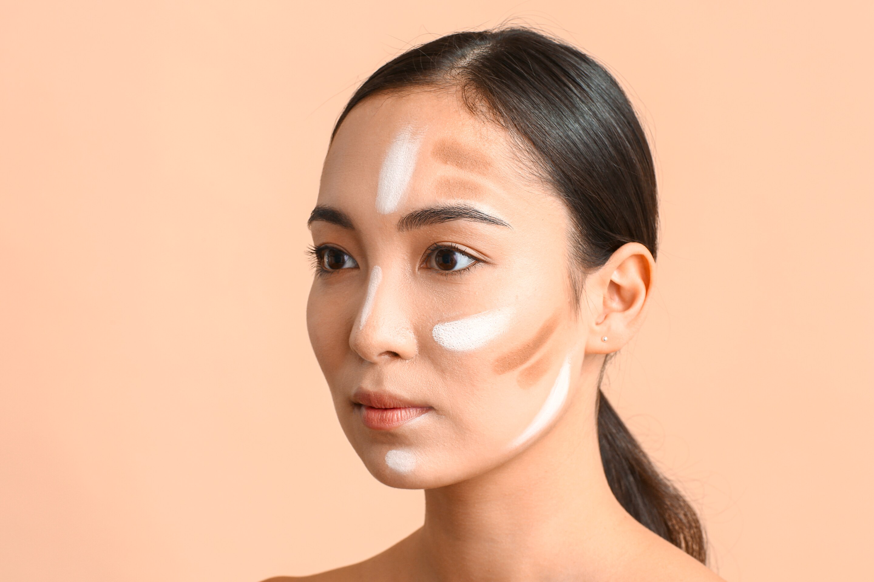 Asian woman with highlight and contour on her face