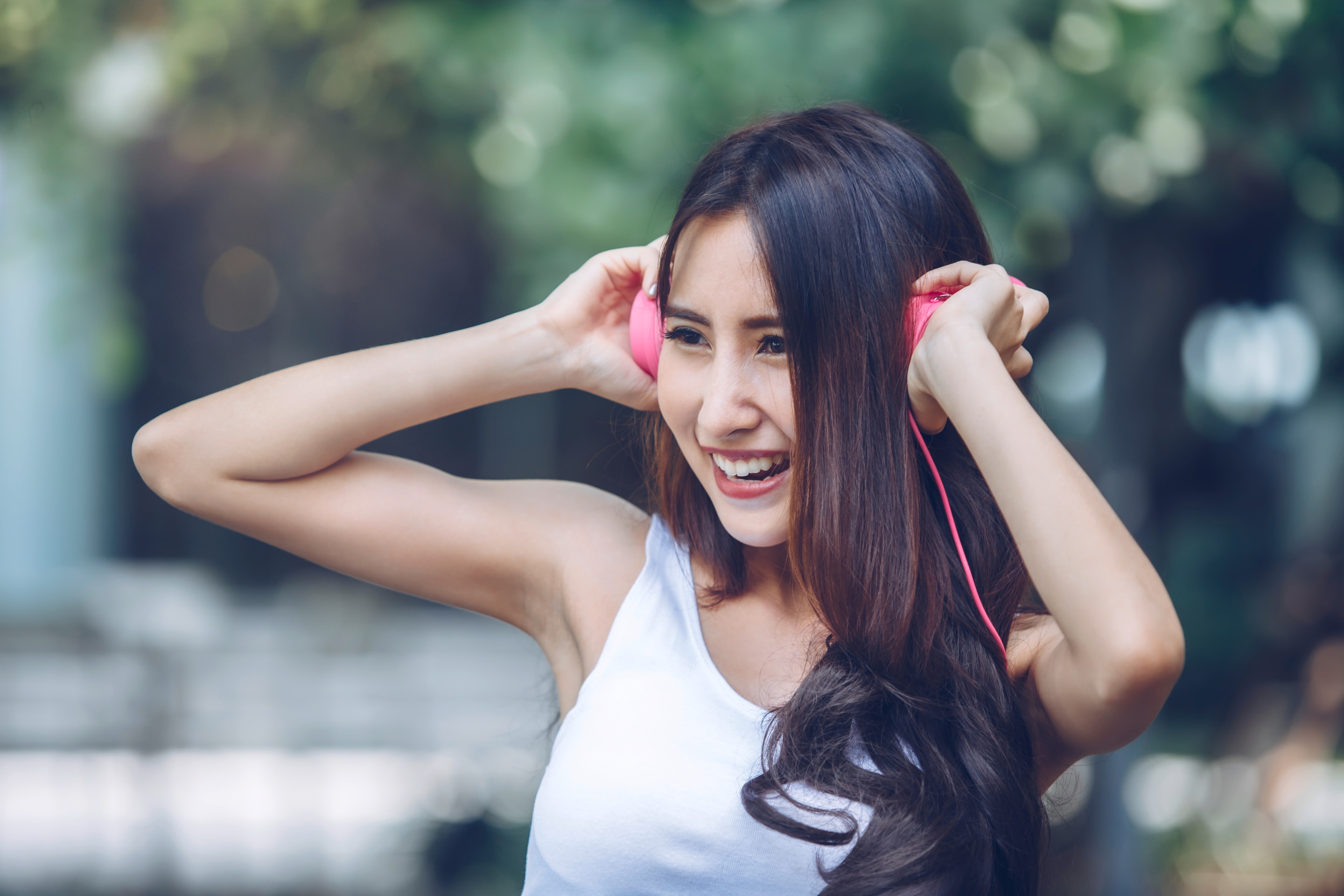 Asian woman active in sleeveless