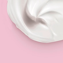 Cleansing balm in a jar against pink background