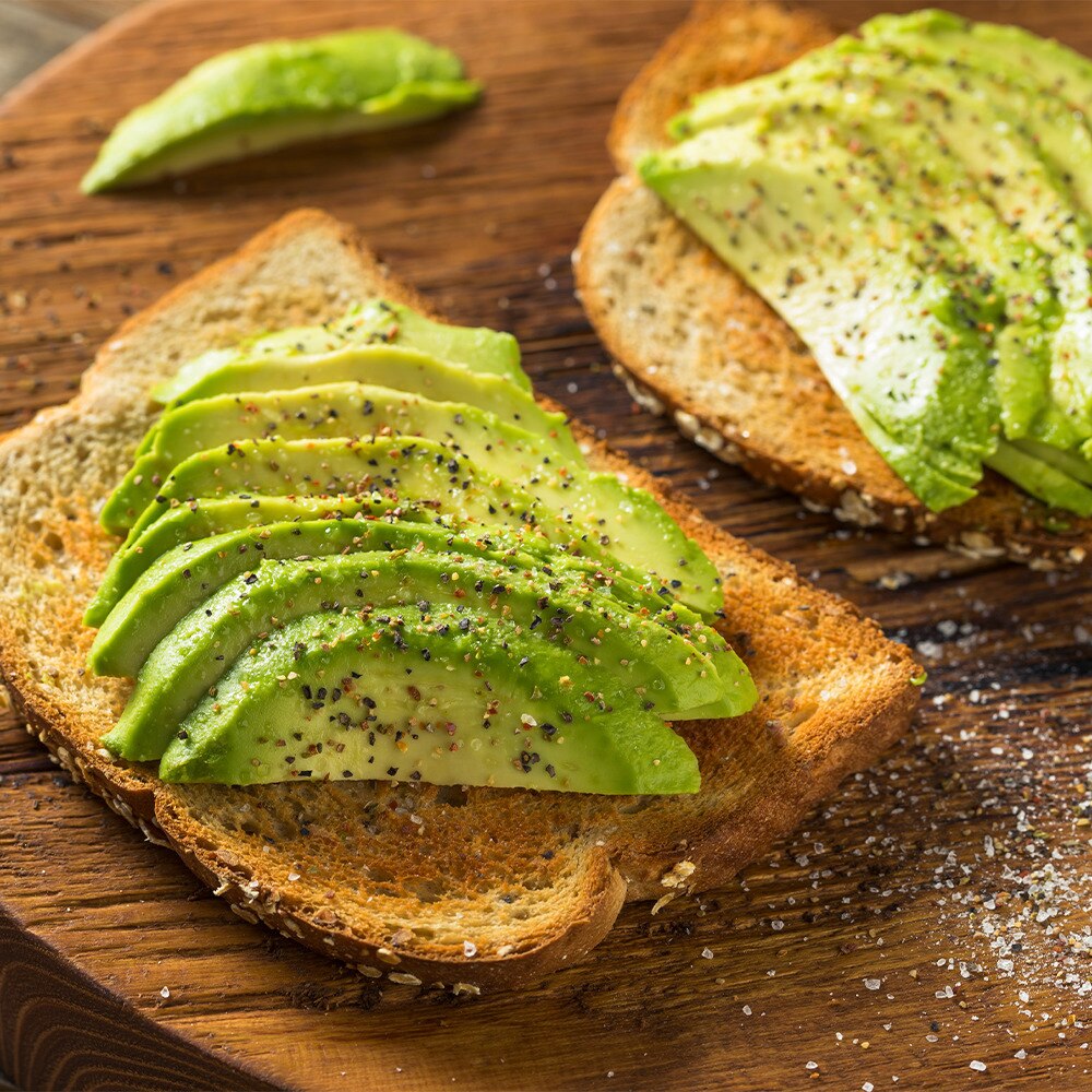 sliced avocado on toast with salt and pepper