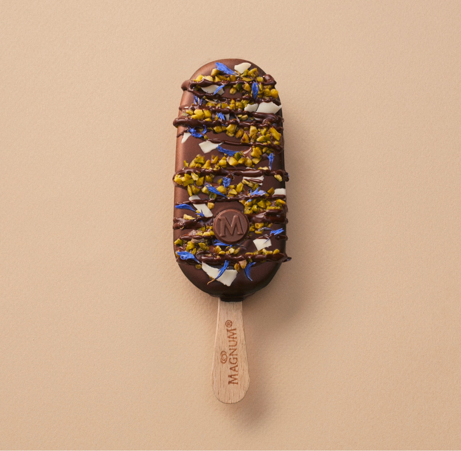 Magnum Classic with rich melted chocolate, pistachio pieces, white chocolate flakes, cornflower and dark chocolate sauce