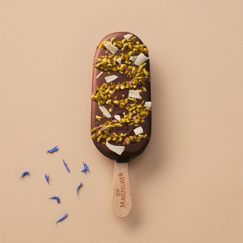 Magnum Classic with rich melted chocolate, pistachio pieces and white chocolate flakes