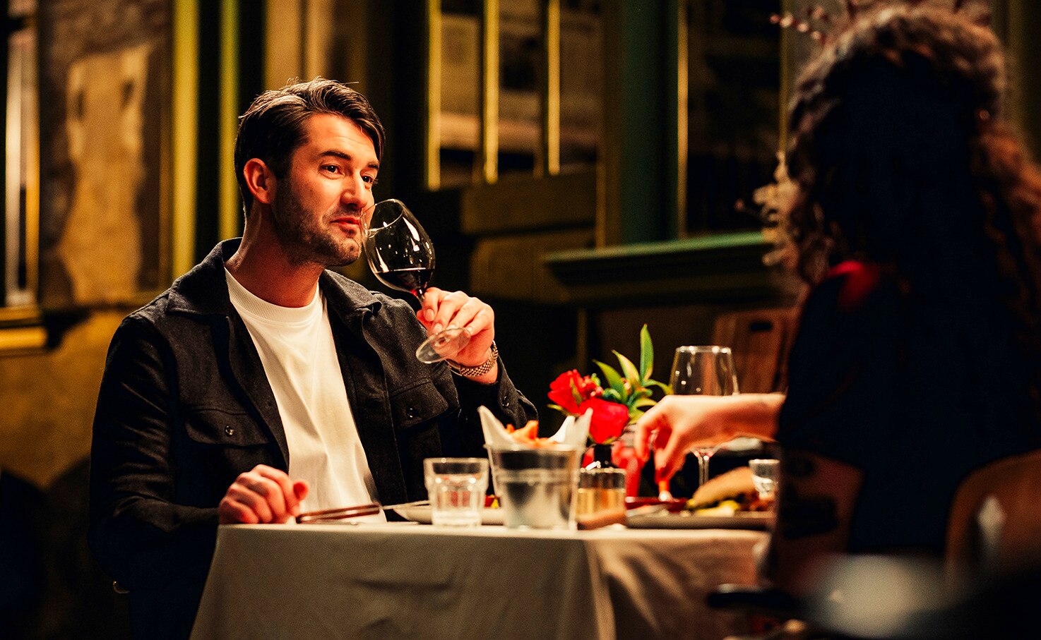 A couple at a dinner table on a date