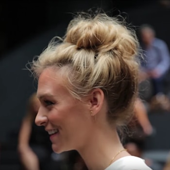 Close up of blogger Mary Seng with her hair styled in a top knot.