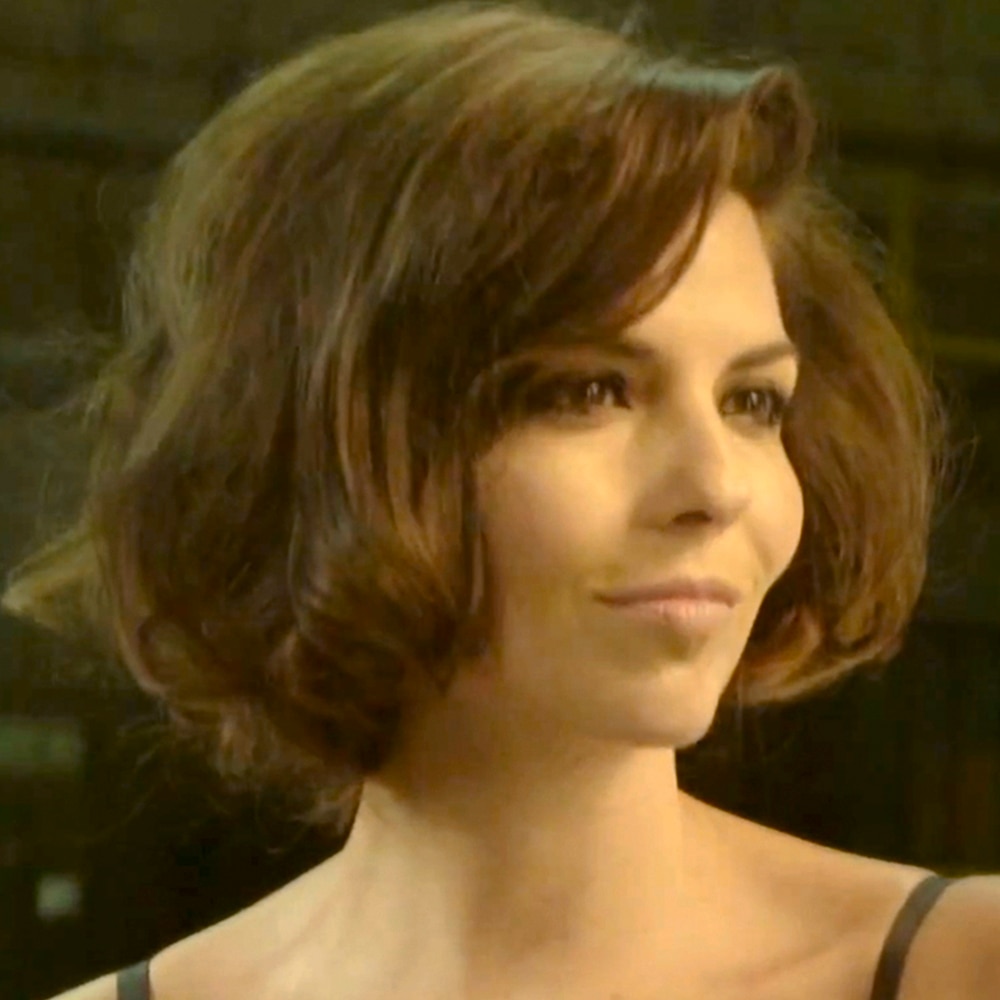Woman with dark bown hair in a faux bob hairstyle