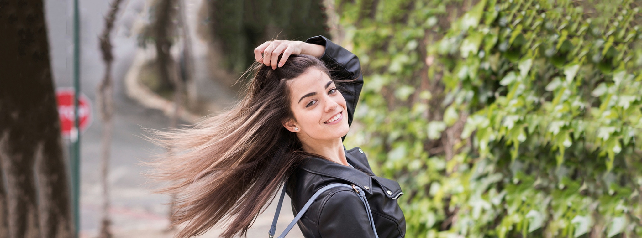 Model with straight hair and black jacket for page and antidandruff tips, from Silk.